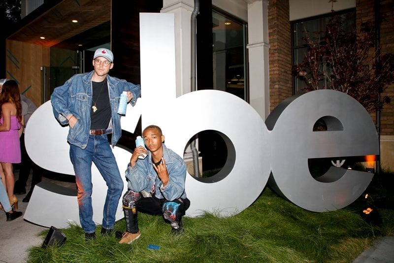 Jaden Smith and Friend posing with the sbe sign outside of Umami Burger